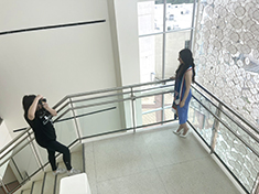 Evangelina Vazquez, class of 2022 participating in the Commencement Hot Spot Shot in the Marilyn Davies College of Business