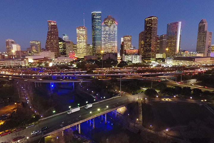Nighttime photo of Houston skyline.