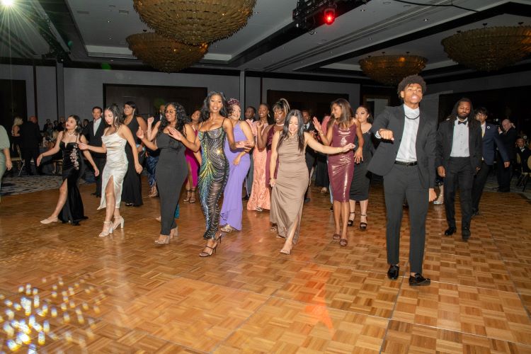 Students dancing in formal wear at the gala.