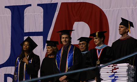 Chris Graves on stage at commencement