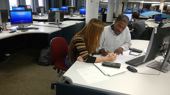 Tutoring session at computer stations in the Academic Support Center